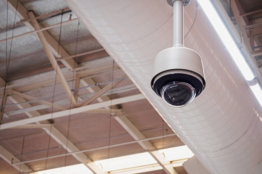 A commercial security camera overlooking a business space.
